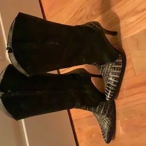 Leather/Snake skin high heel western boots.